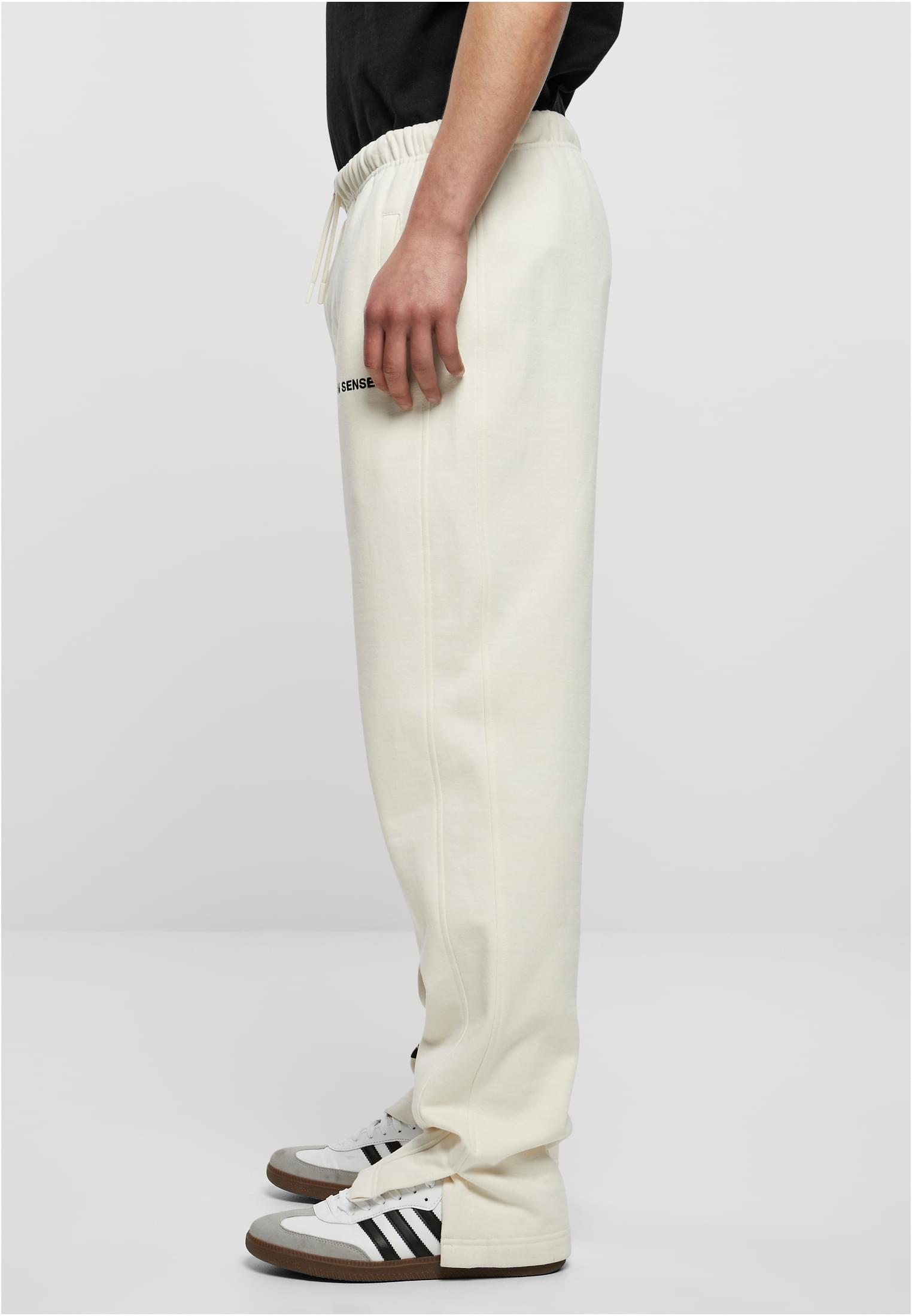 9N1M Sense Pantaloni della tuta Sense whitesand XXS